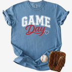 Blue t-shirt with 'GAME Day' text, baseball, and glove on a white background