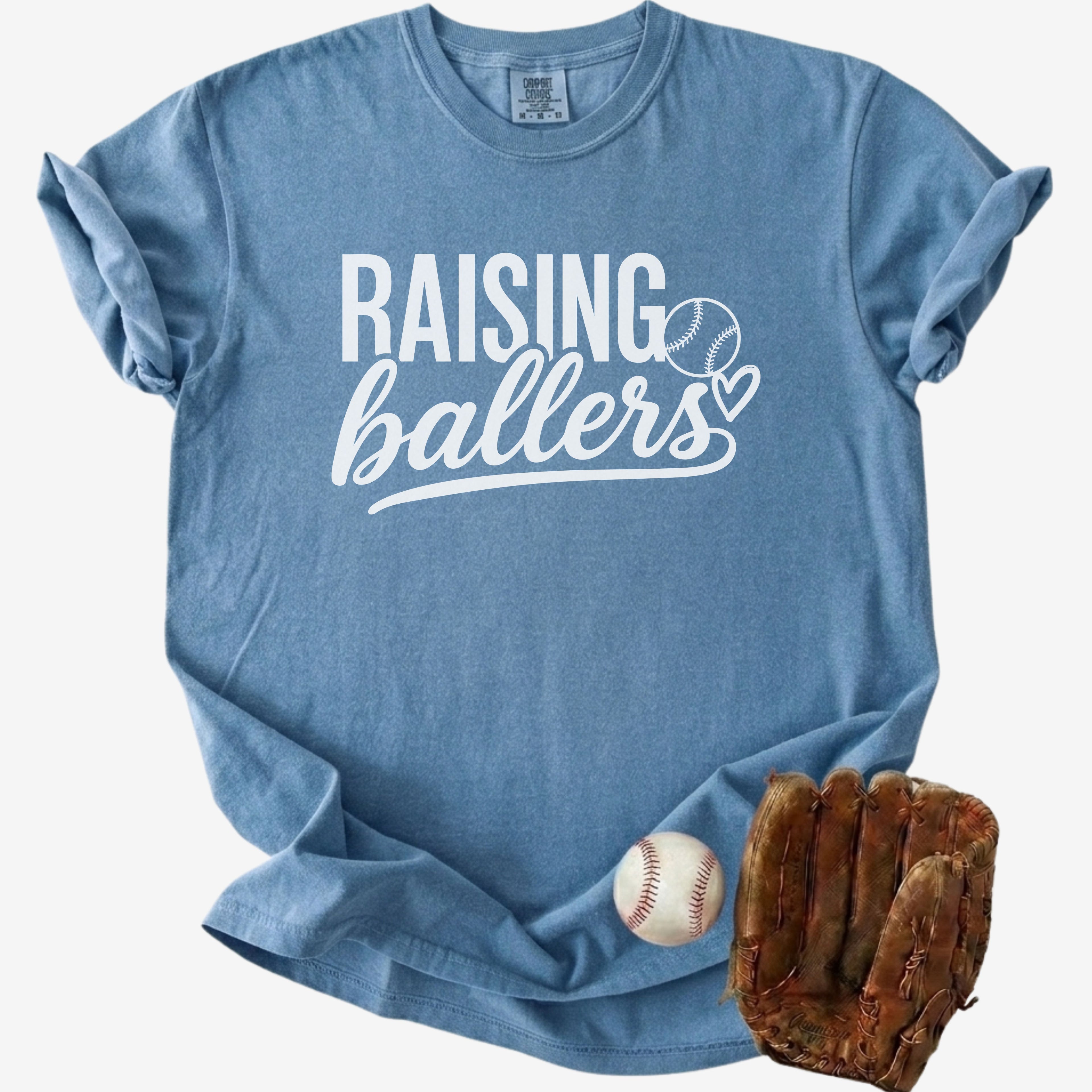 Blue t-shirt with 'RAISING ballers' text, baseball, and glove on a white background