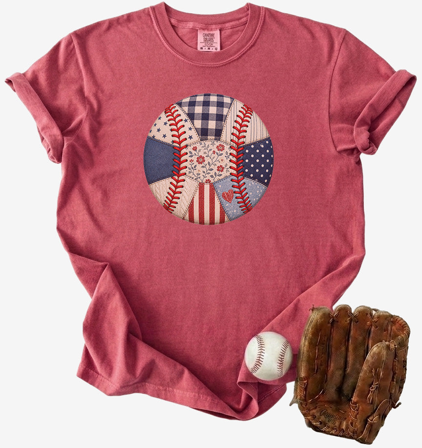 Red t-shirt with a baseball graphic, accompanied by a baseball and glove on a white background