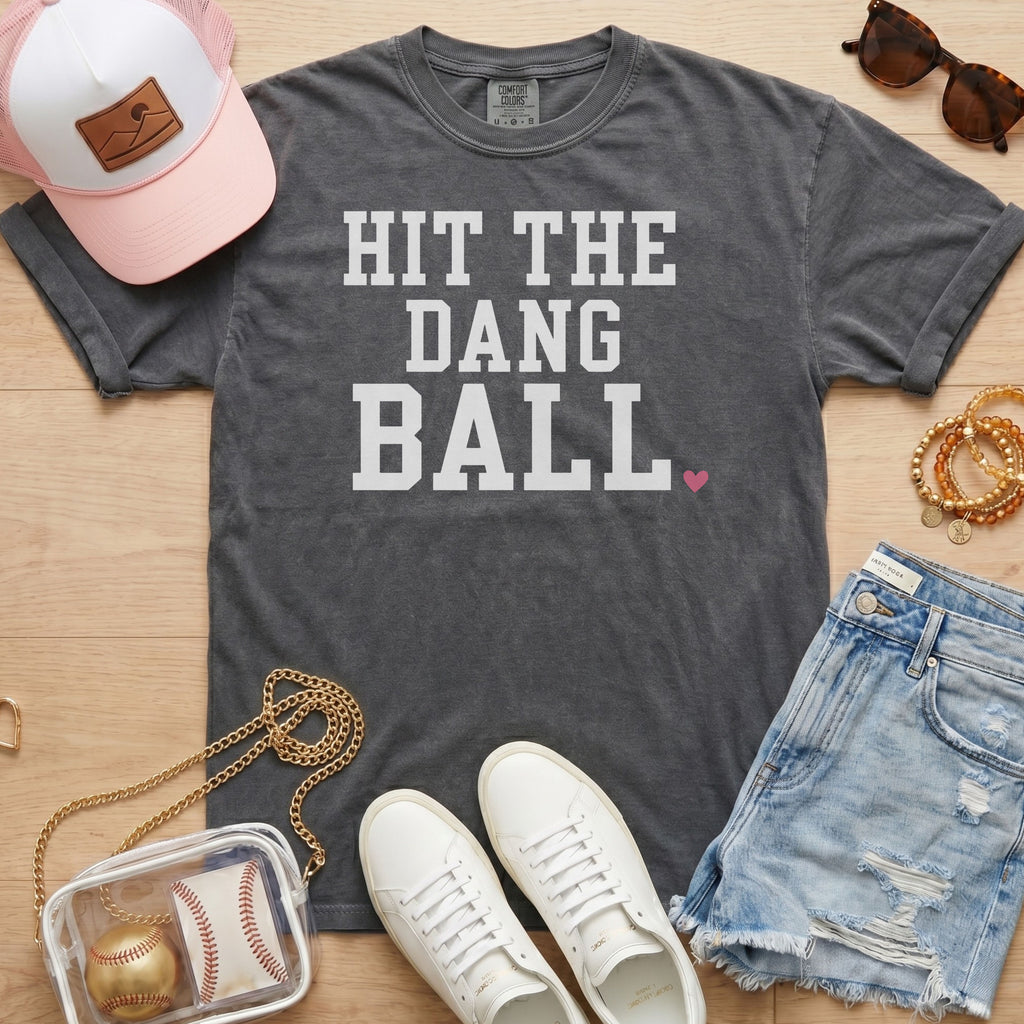 Pepper Comfort Colors trendy baseball mom shirt with white
Hit The Dang Ball lettering and pink heart, styled for game day.