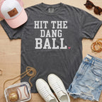 Pepper Comfort Colors trendy baseball mom shirt with white
Hit The Dang Ball lettering and pink heart, styled for game day.