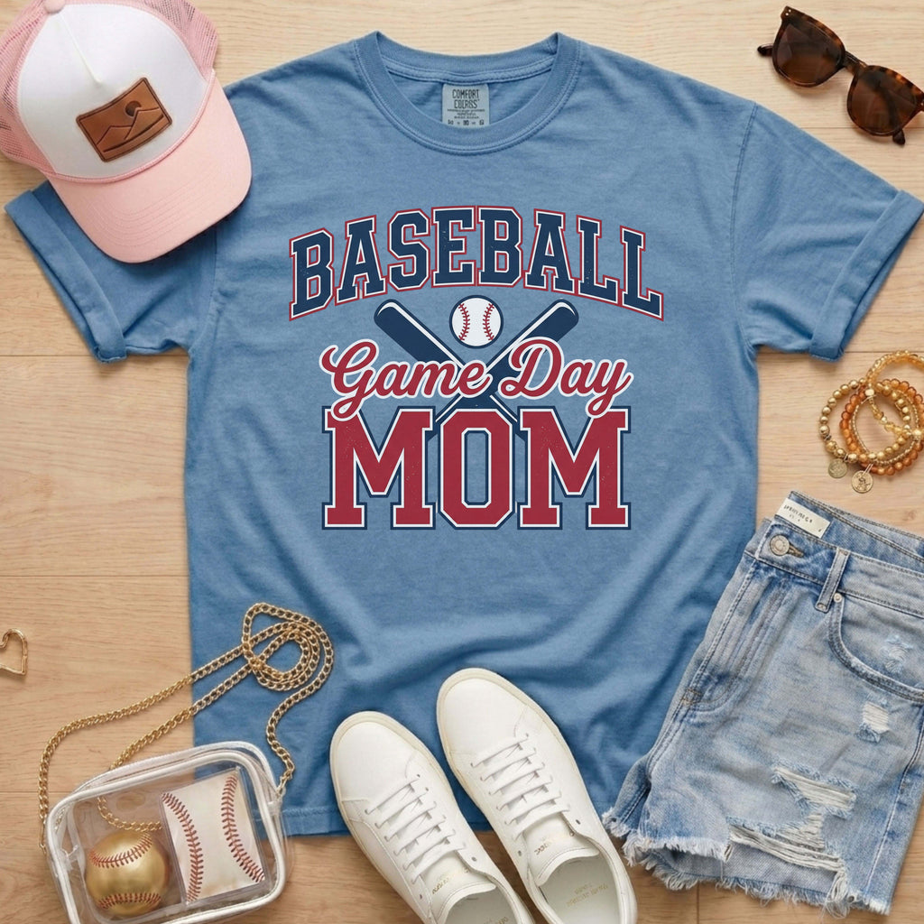 Blue Comfort Colors baseball mom shirt with game day graphic, denim shorts, sneakers, and baseball accessories