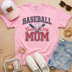 Pink Comfort Colors baseball mom shirt with sporty game day design and baseball mom outfit flat lay