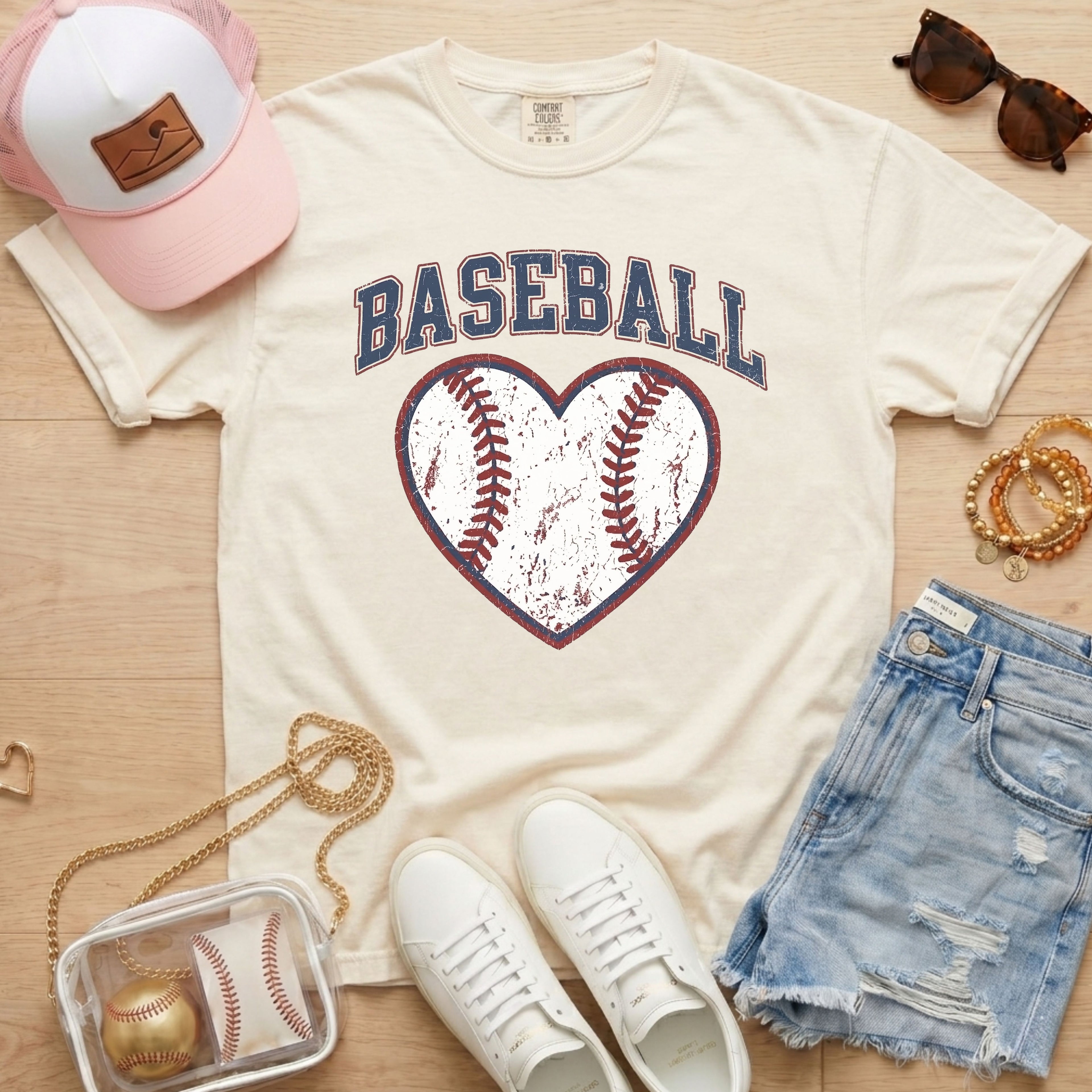 baseball mom shirt ivory graphic tee styled with glove and baseball flat lay