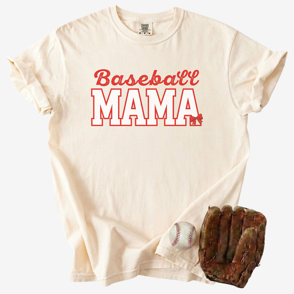 vory t-shirt with Baseball Mama red text design next to a baseball glove and ball on a clean white background
