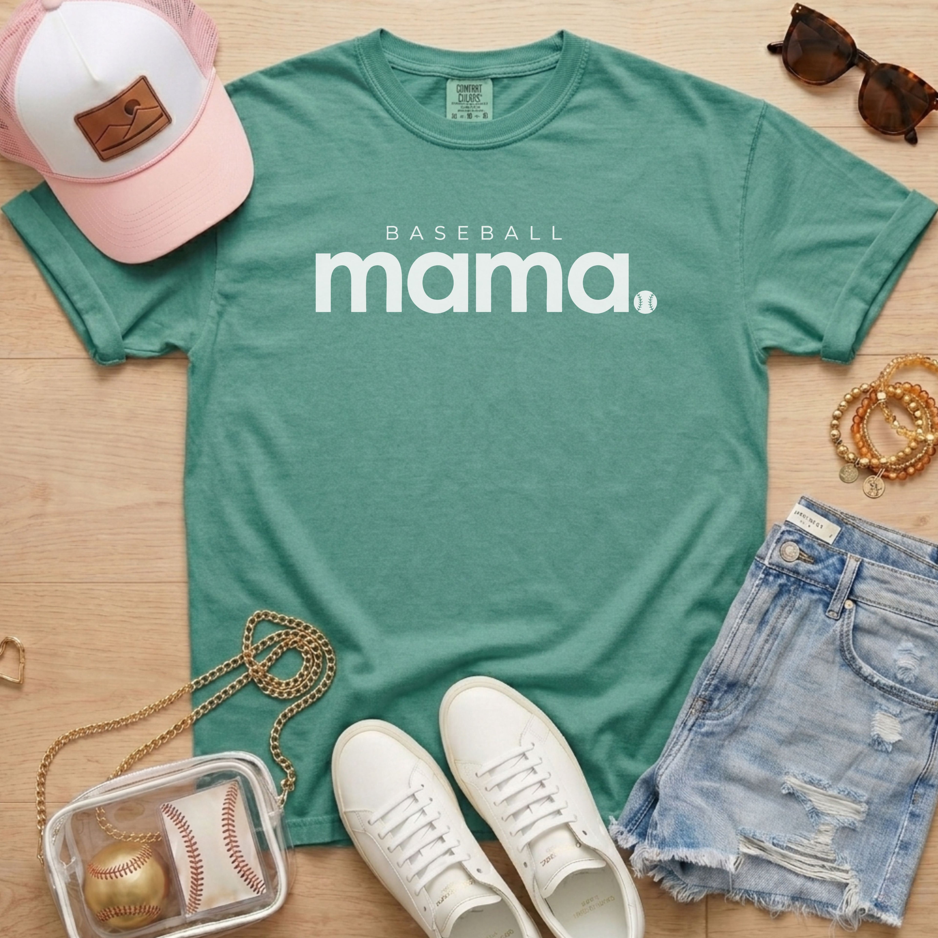 Light green Comfort Colors 1717 shirt with white Baseball Mama lettering and baseball graphic