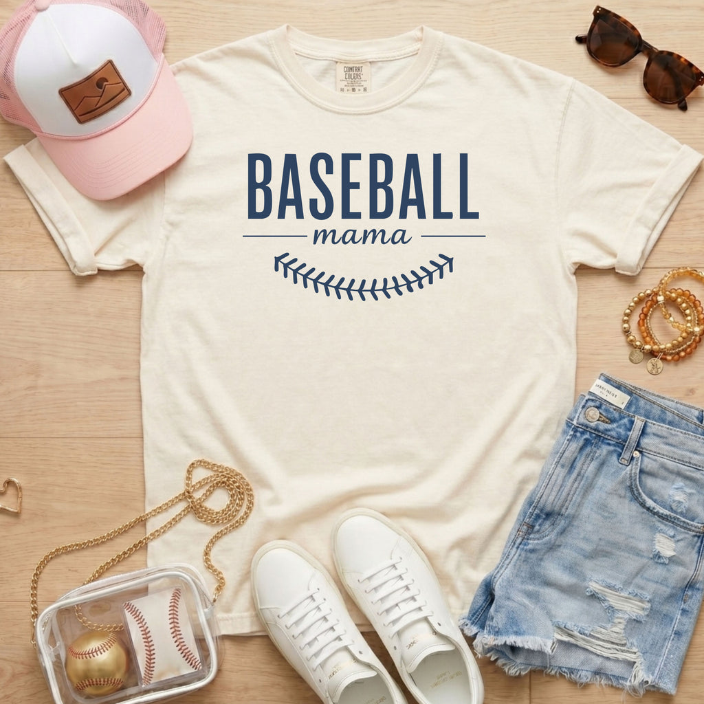 Ivory Comfort Colors 1717 Baseball Mama tee with navy blue text and baseball stitches for a classic sports mom look