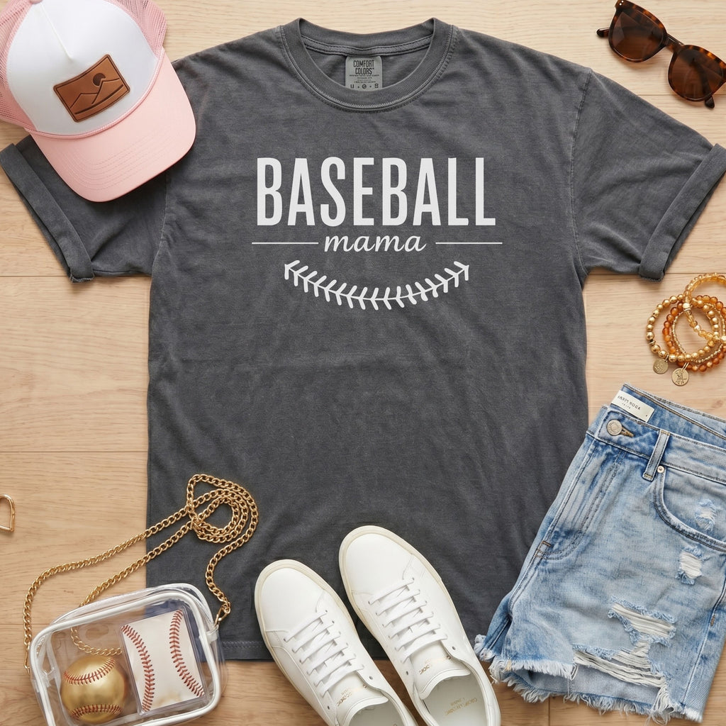 Baseball Mama shirt in pepper grey Comfort Colors 1717 featuring white block lettering and baseball stitch graphic
