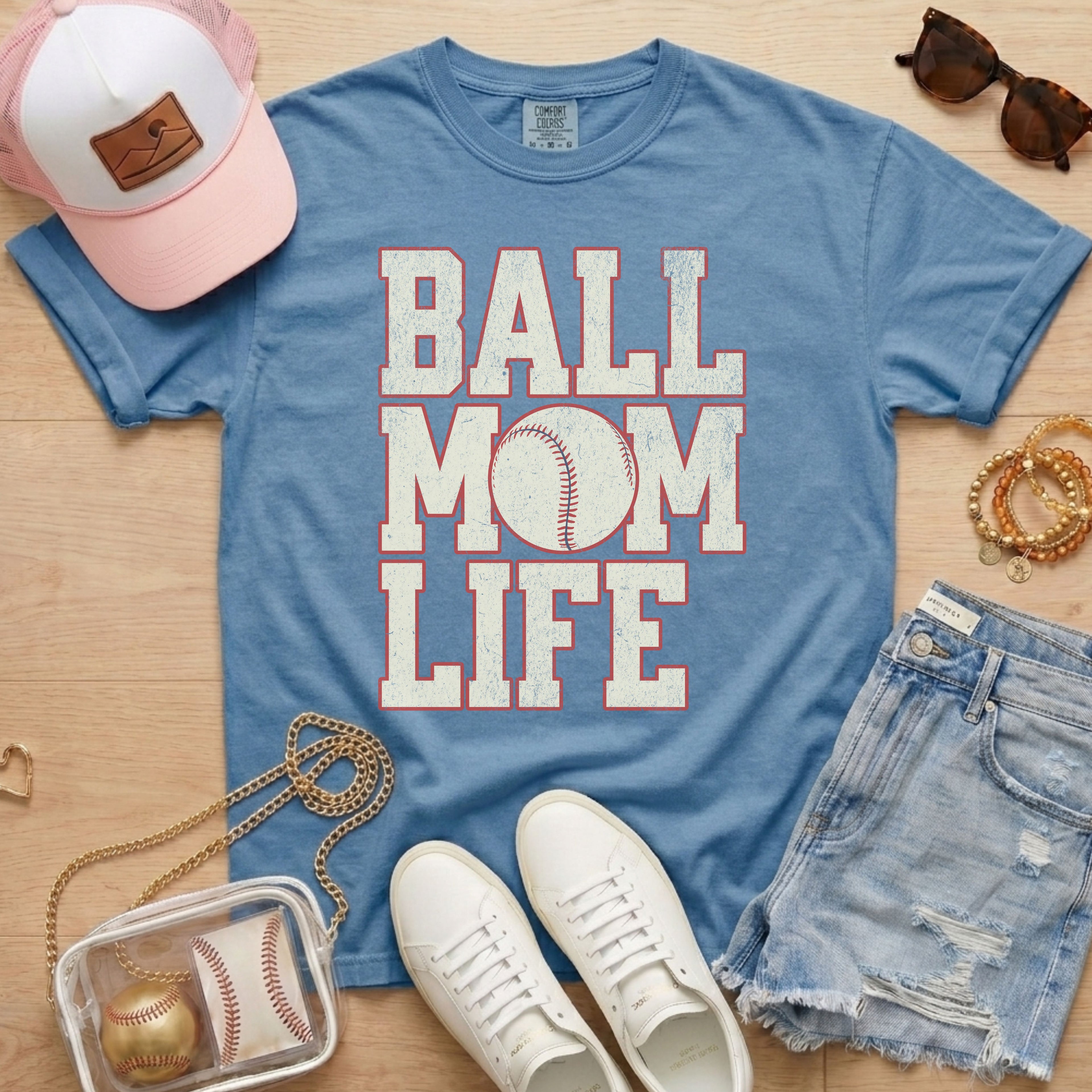 blue baseball mom life shirt styled with sneakers and denim shorts for game day outfit