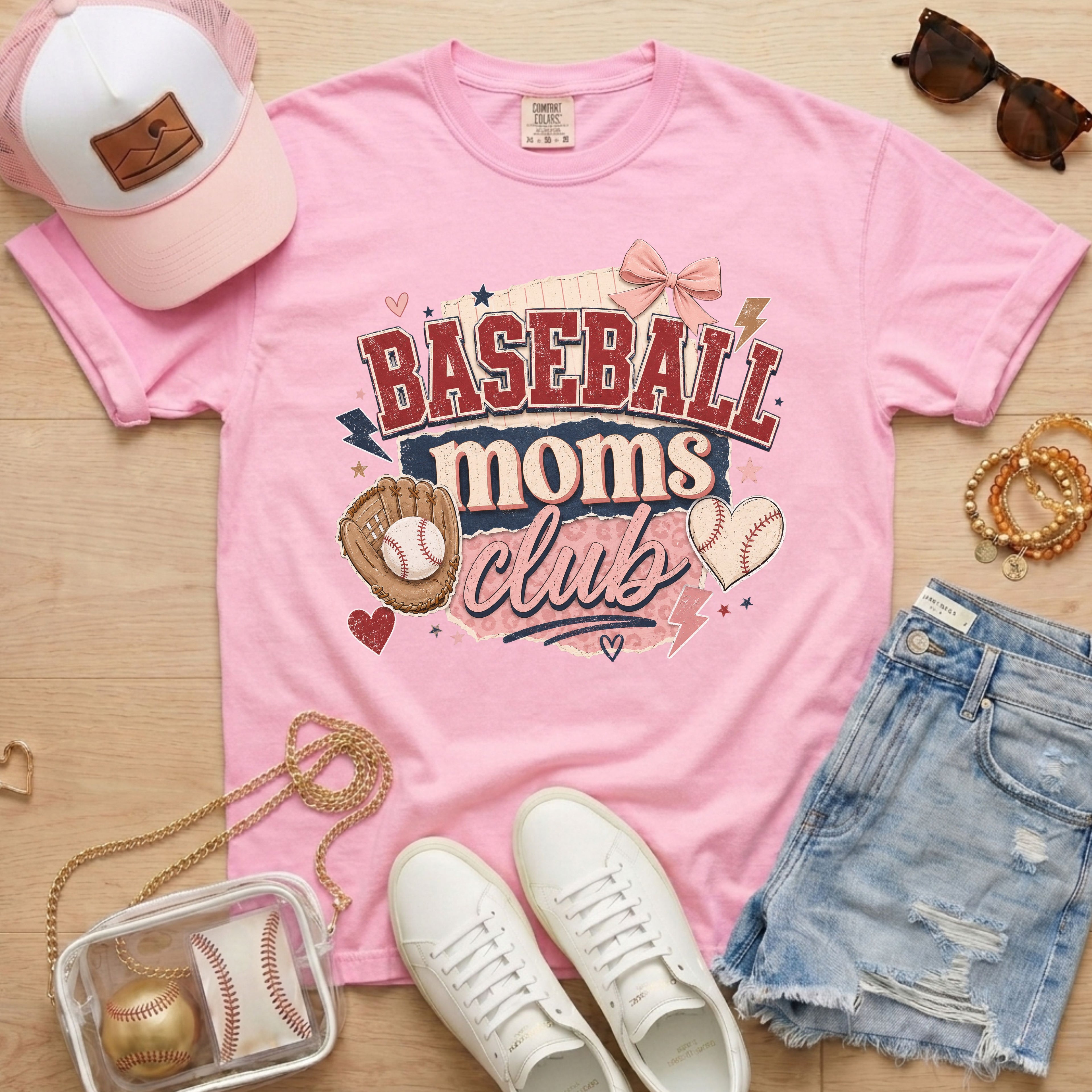 Baseball Moms Club Comfort Colors tee in blossom light pink flat lay with trucker hat, denim shorts, white sneakers, and baseball.