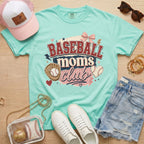 Baseball Moms Club Comfort Colors tee in chalky mint flat lay with trucker hat, denim shorts, white sneakers, and baseball.