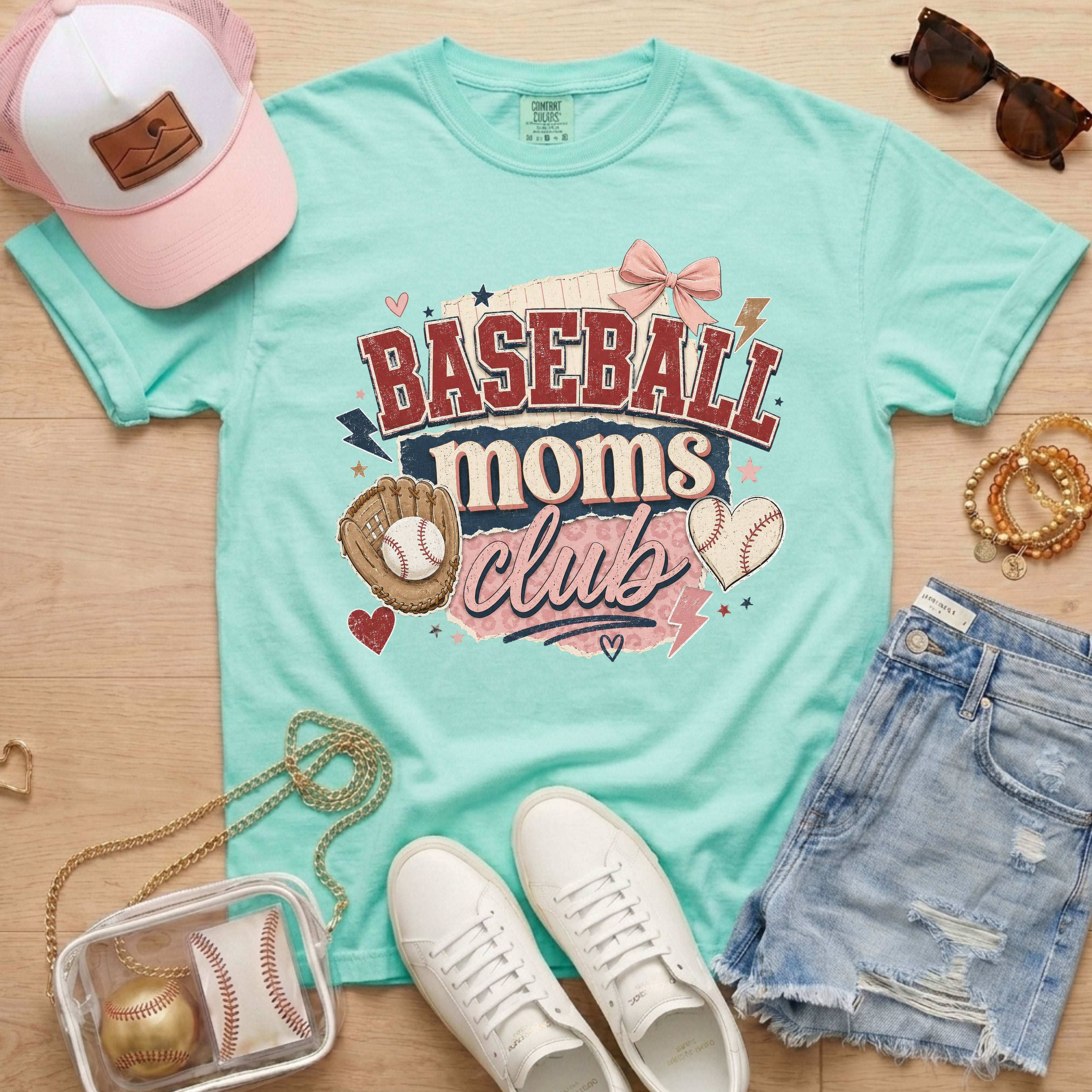 Baseball Moms Club Comfort Colors tee in chalky mint flat lay with trucker hat, denim shorts, white sneakers, and baseball.