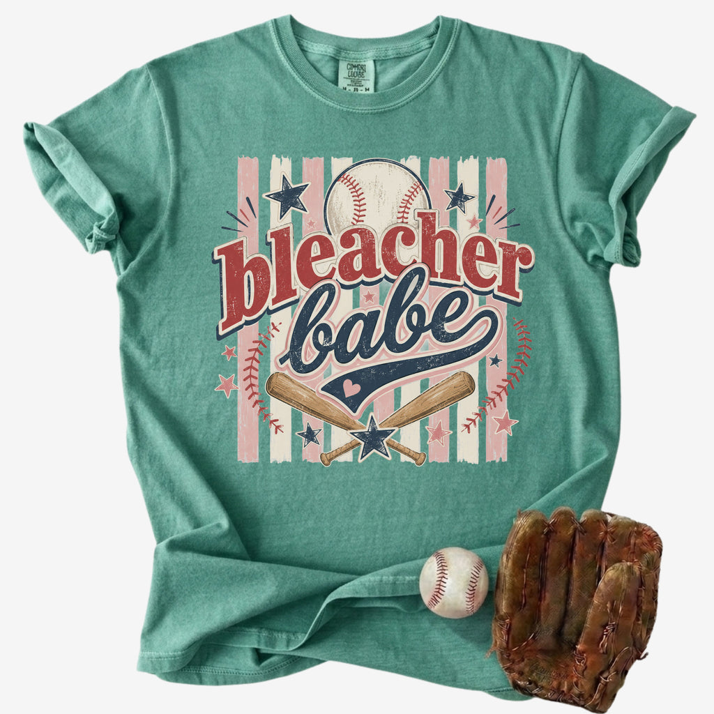 Bleacher Babe baseball mom Comfort Colors tee on white background with baseball and glove.