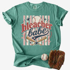 Bleacher Babe baseball mom Comfort Colors tee on white background with baseball and glove.