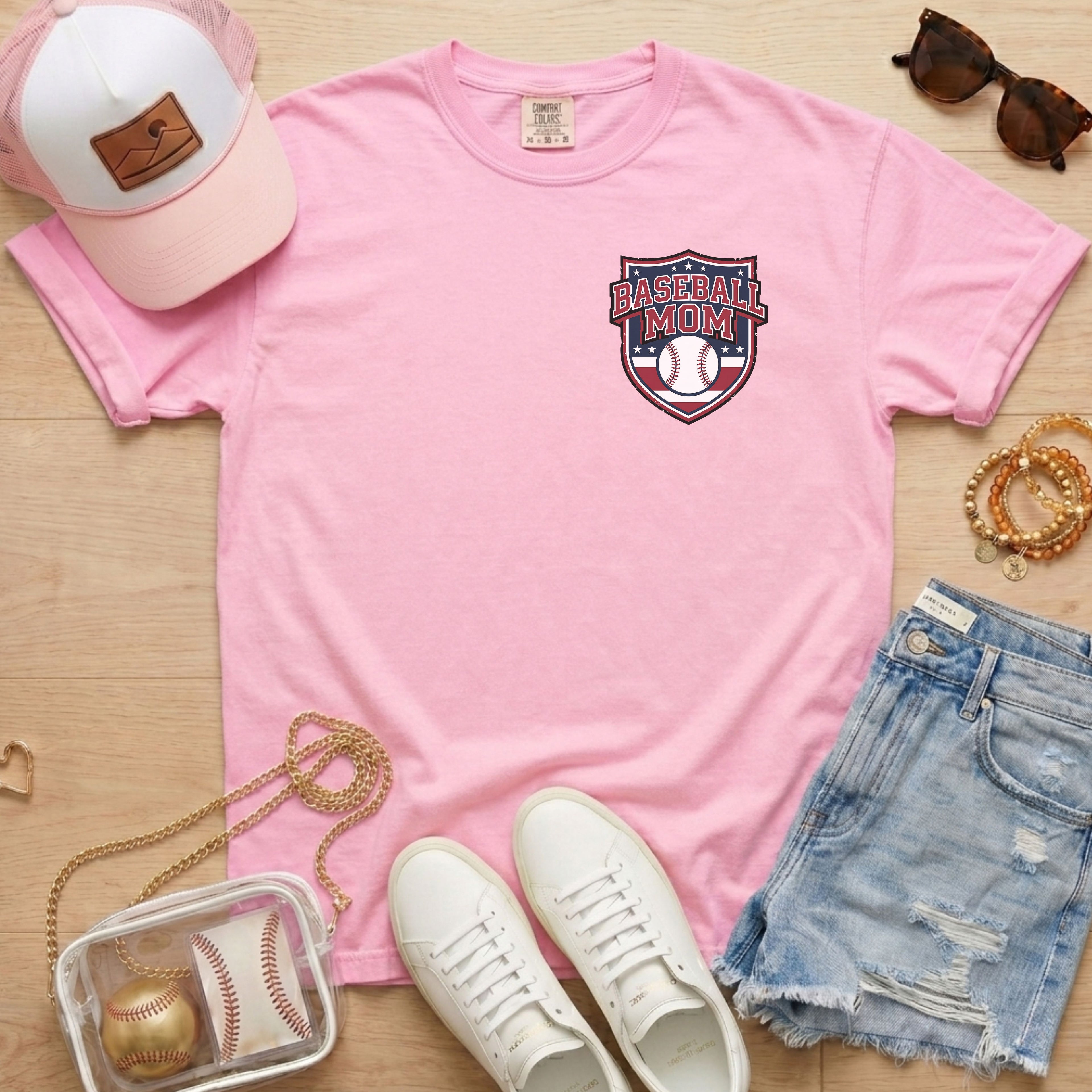 Pink Comfort Colors 1717 t-shirt featuring a vintage Baseball Mom shield logo for game day outfits