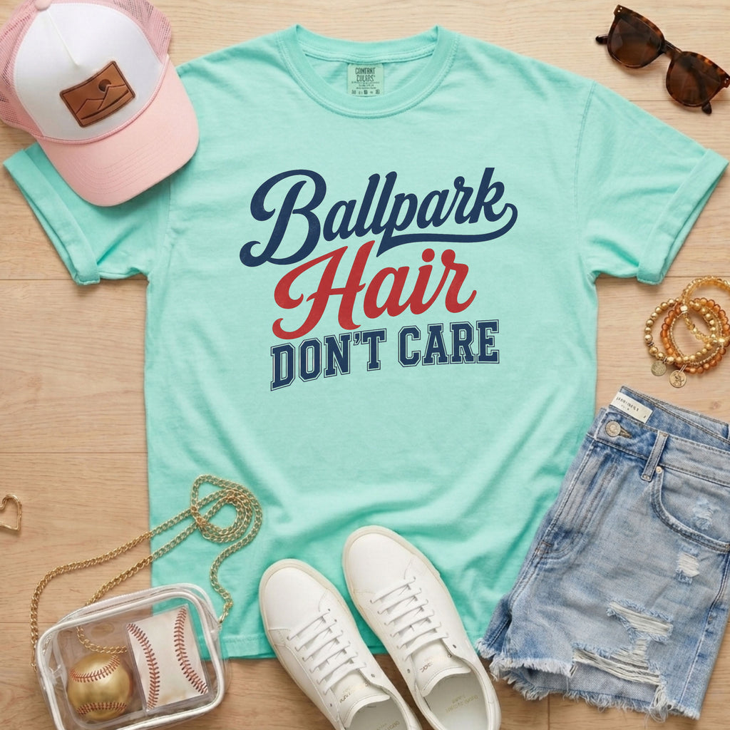 Chalky Mint Ballpark Hair Don’t Care funny baseball mom tee on Comfort Colors shirt styled with baseball accessories, denim shorts, and white sneakers.