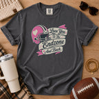 Charcoal gray football mom shirt, Comfort Colors Pepper, styled in a flat lay with a football, tumbler and “Love You to the Endzone and Back” graphic.