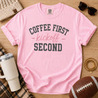 Blossom Pink Comfort Colors football mom shirt with Coffee First Kickoff Second design and football prop.