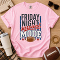 Blossom football mom shirt with Friday Night Survival Mode design on a game day flat lay.