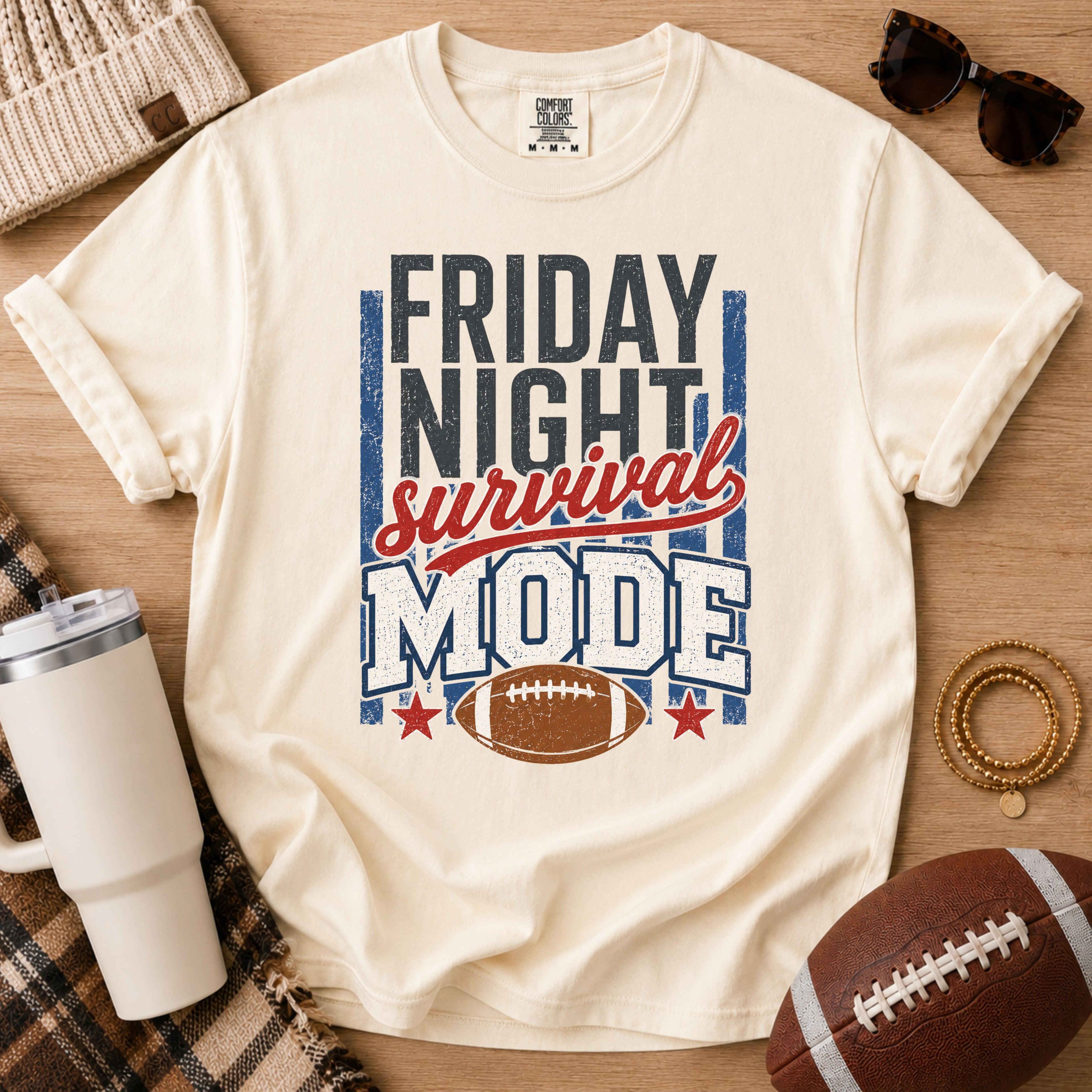 Ivory football mom shirt with Friday Night Survival Mode graphic and football game day styling.