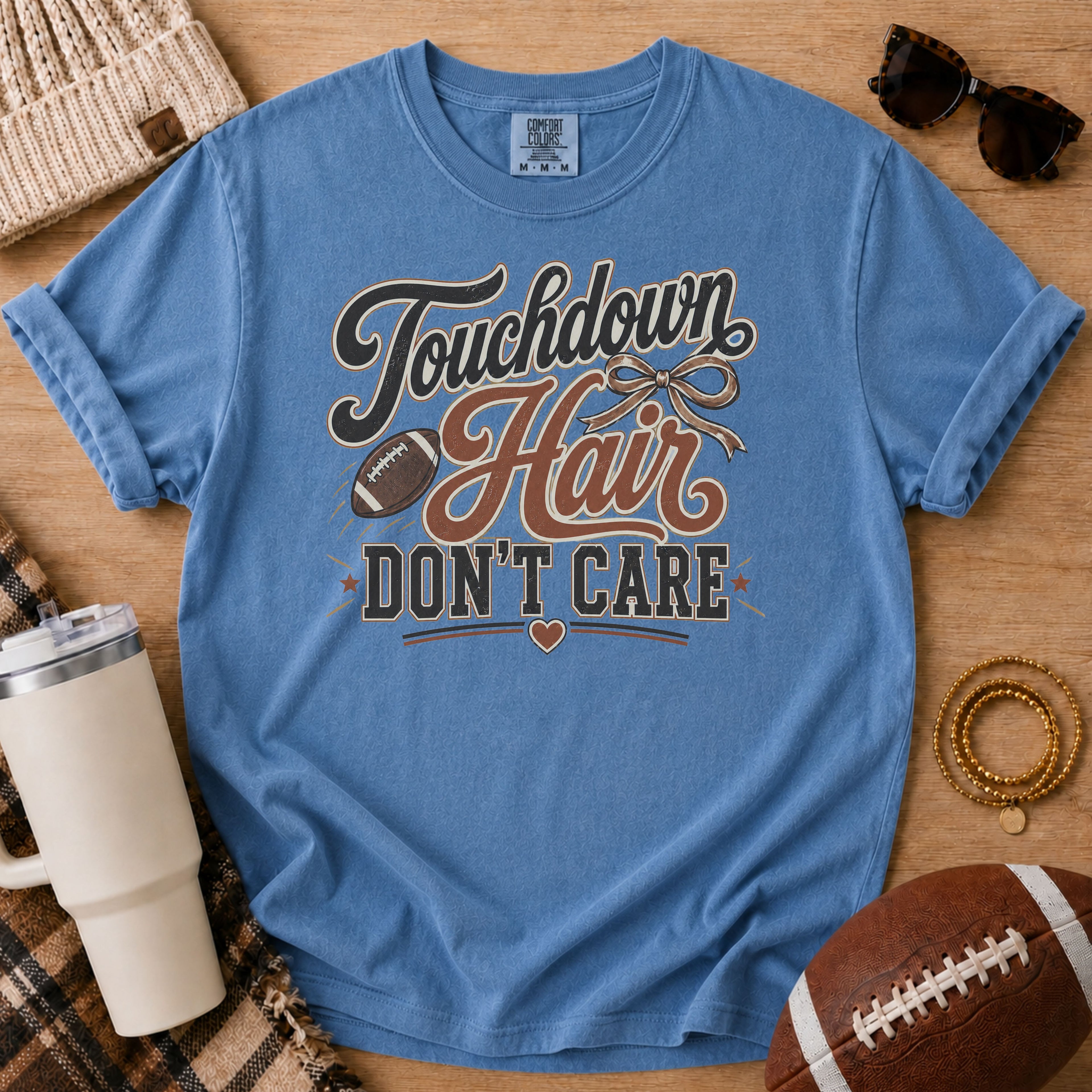 Blue Jean football mom Comfort Colors shirt with muddy football cleats design for game day.