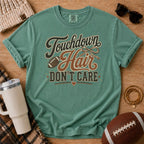 Light Green Comfort Colors football mom shirt with muddy football cleats design for fall game day.