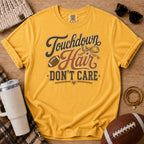 Mustard Comfort Colors football mom shirt with muddy football cleats design for football season.