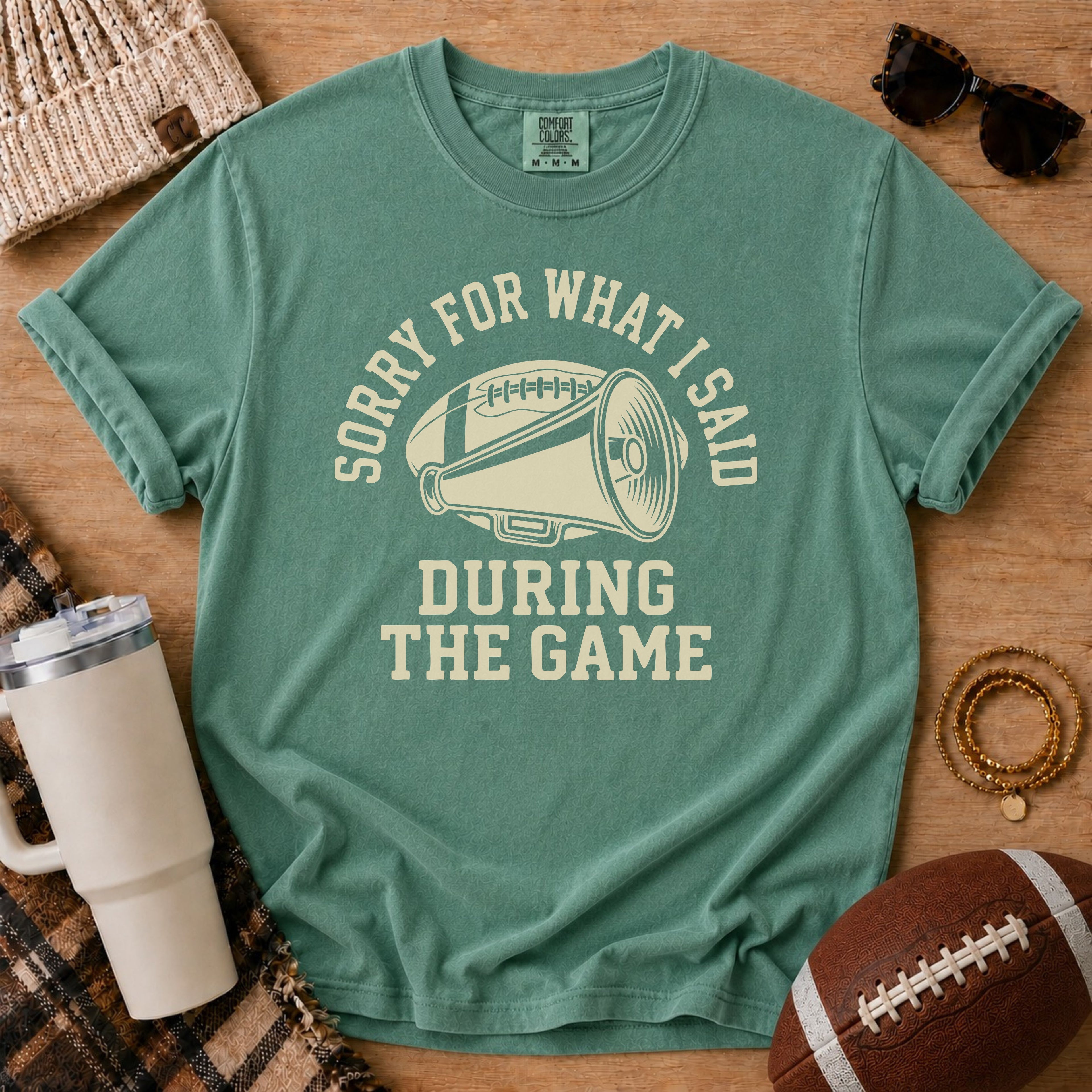 Light Green Comfort Colors football mom shirt with vintage megaphone design for football season.