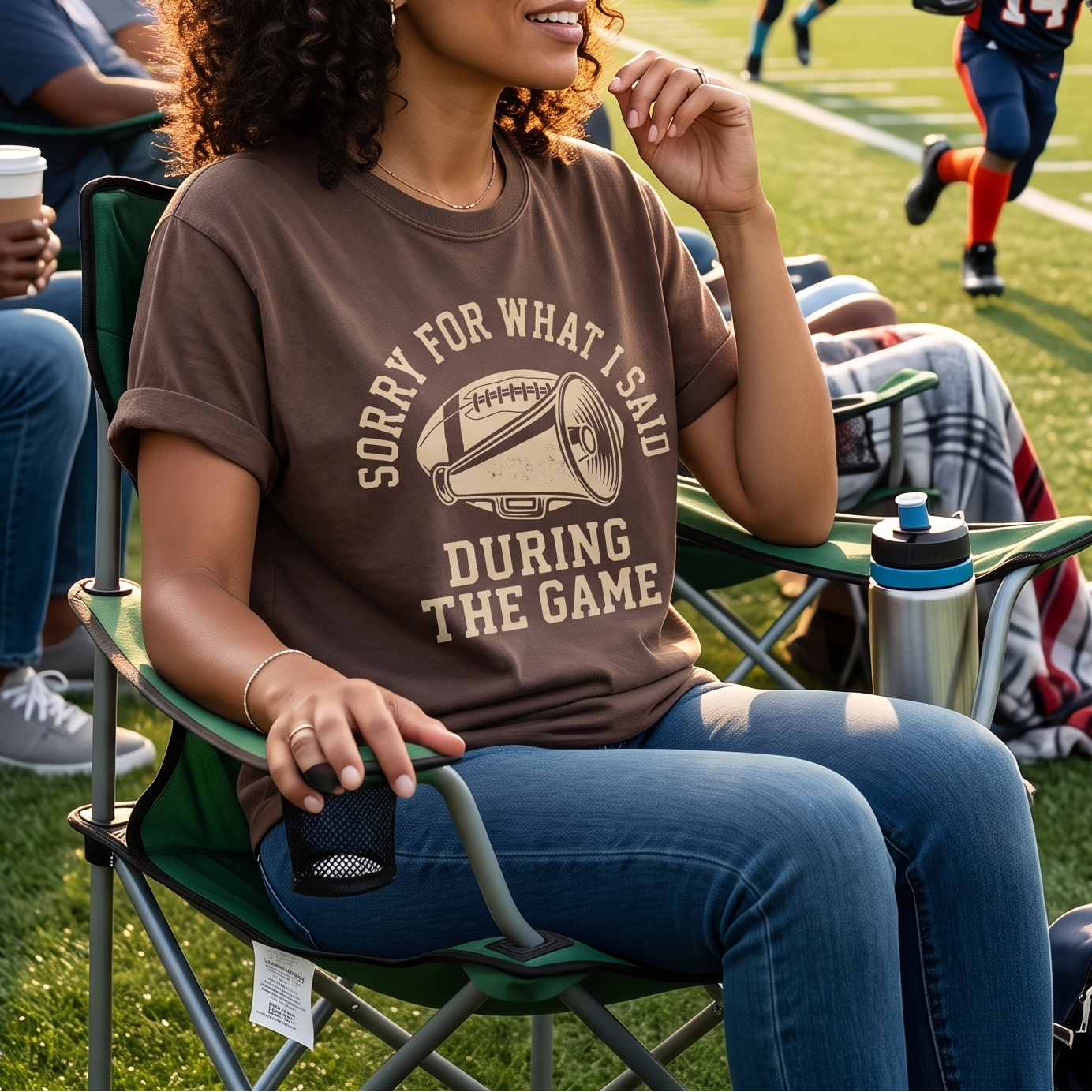 Football mom wearing a Sorry For What I Said During The Game shirt while watching a youth football game.