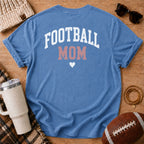 FOOTBALL MOM graphic shirt in vintage blue, Comfort Colors Blue Jean, shown in a styled flat lay from the back.