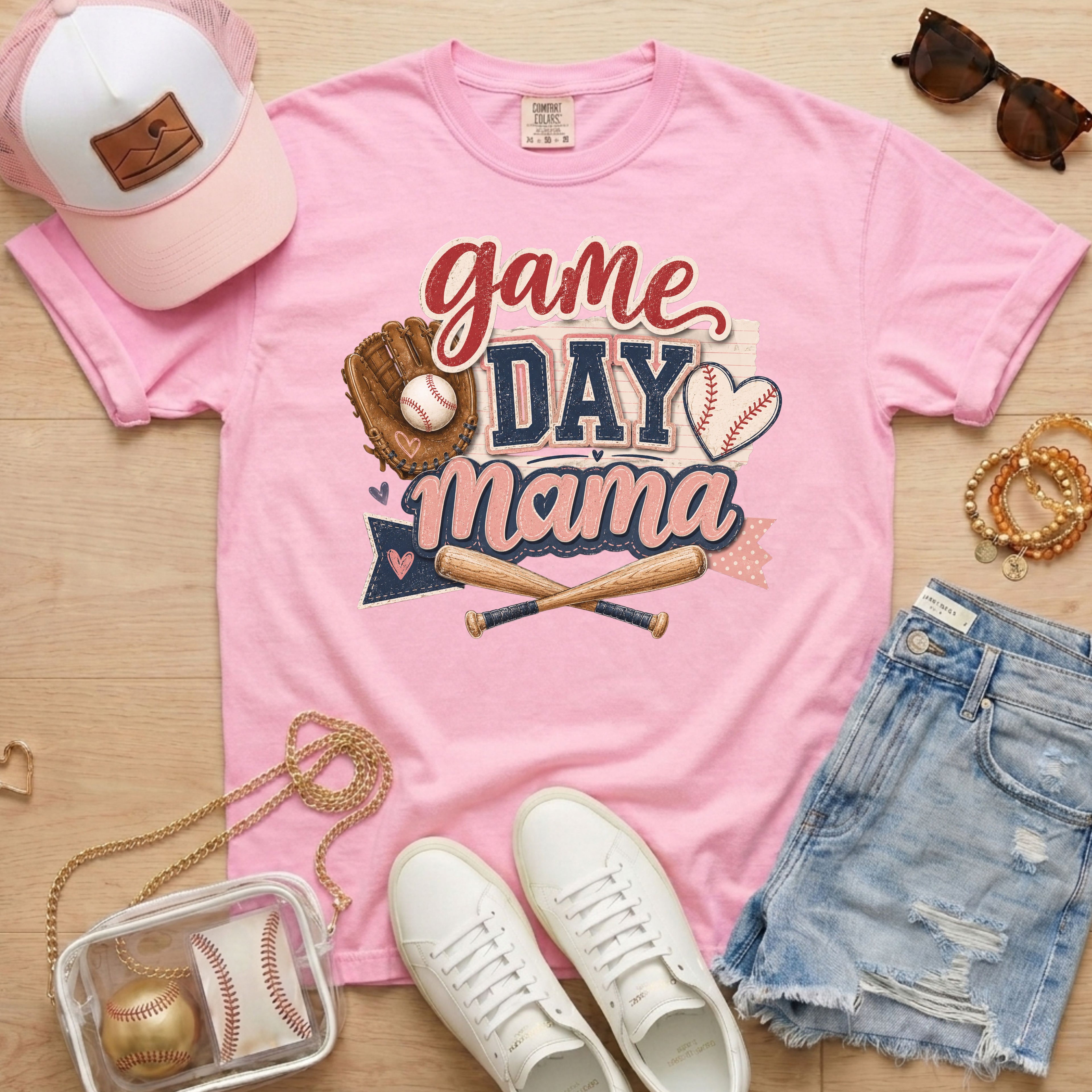 Game Day Mama baseball mom Comfort Colors tee in blossom light pink flat lay with trucker hat, denim shorts, white sneakers, and baseball.