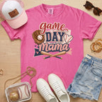 Game Day Mama baseball mom Comfort Colors tee in crunchberry flat lay with trucker hat, denim shorts, white sneakers, and baseball.