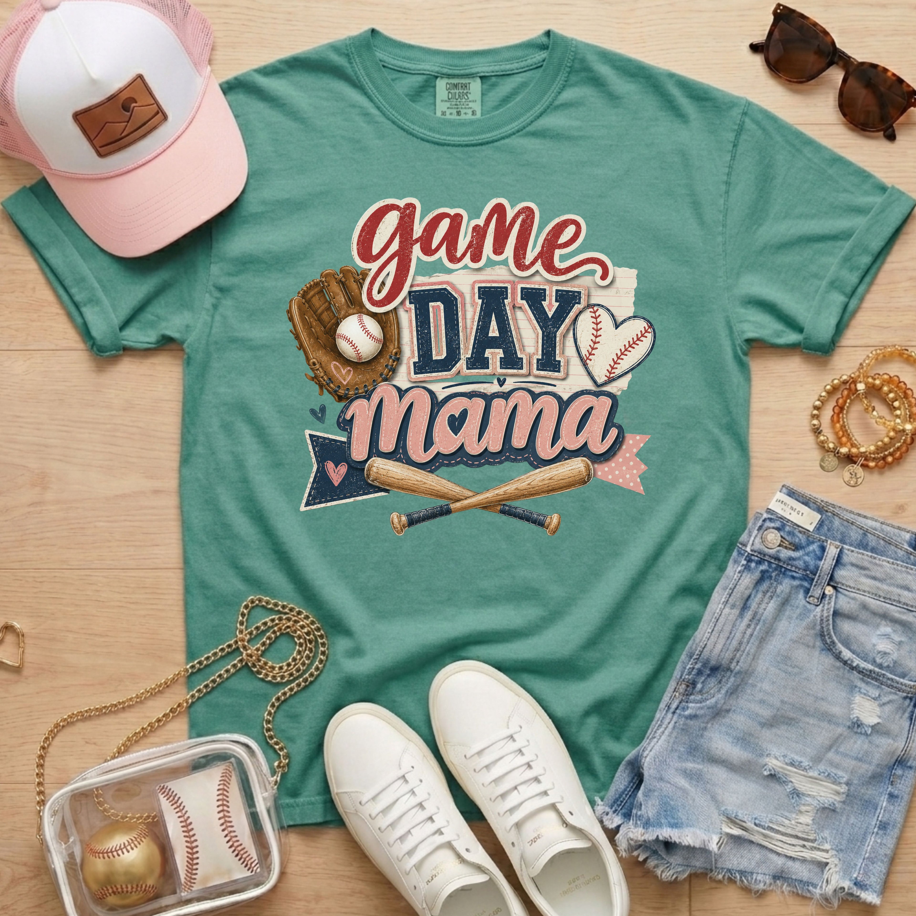 Game Day Mama baseball mom Comfort Colors tee in light green flat lay with trucker hat, denim shorts, white sneakers, and baseball.