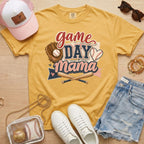 Game Day Mama baseball mom Comfort Colors tee in mustard flat lay with trucker hat, denim shorts, white sneakers, and baseball.