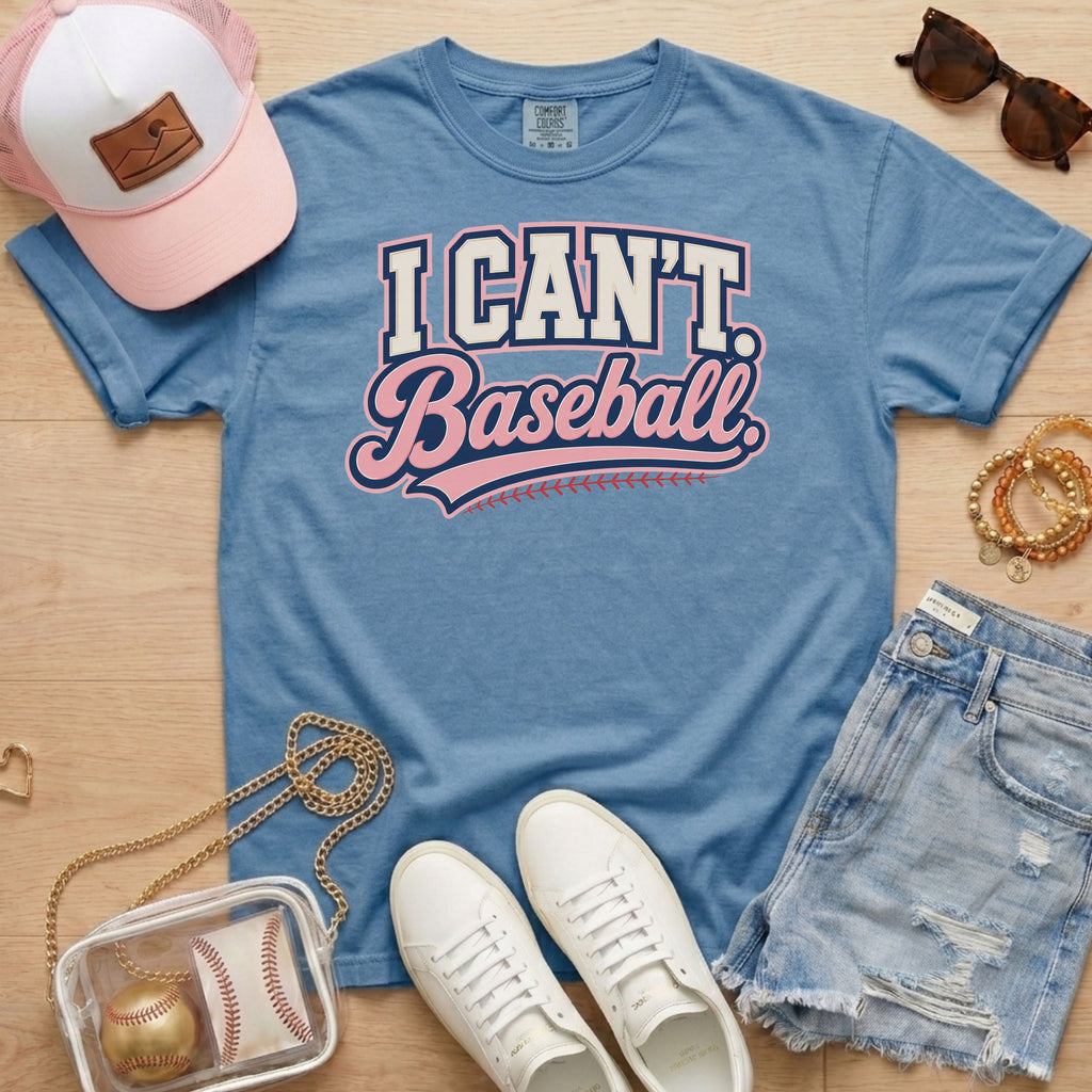 I CAN'T. Baseball. baseball mom Comfort Colors blue jean tee in a game day flat lay with hat, sneakers, denim shorts, and baseball bag.
