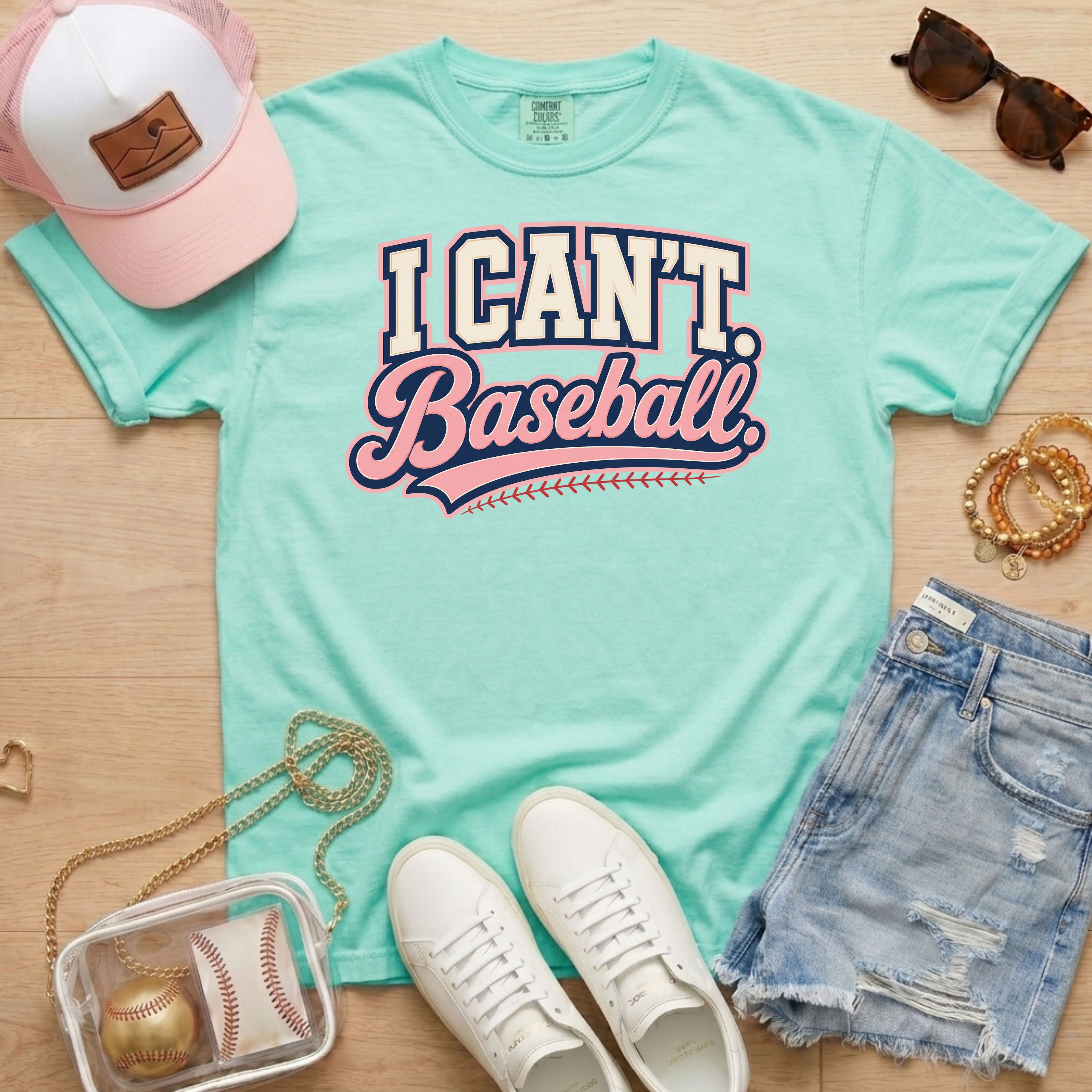 I CAN'T. Baseball. baseball mom Comfort Colors chalky mint tee in a sporty flat lay with pink hat, sneakers, denim shorts, and baseball bag.