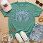 green mom squad shirt baseball mom outfit styled with sneakers and accessories