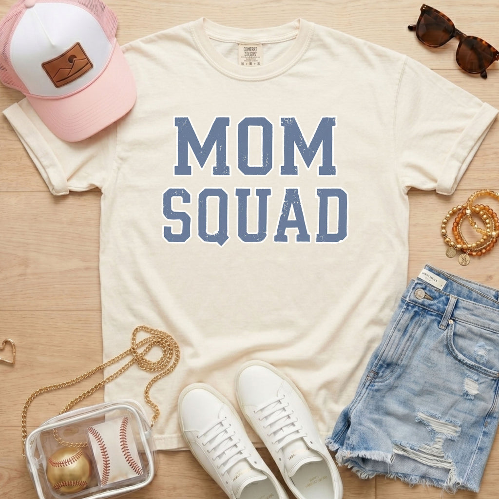 mom squad baseball mom shirt on ivory comfort colors tee styled with hat and denim shorts
