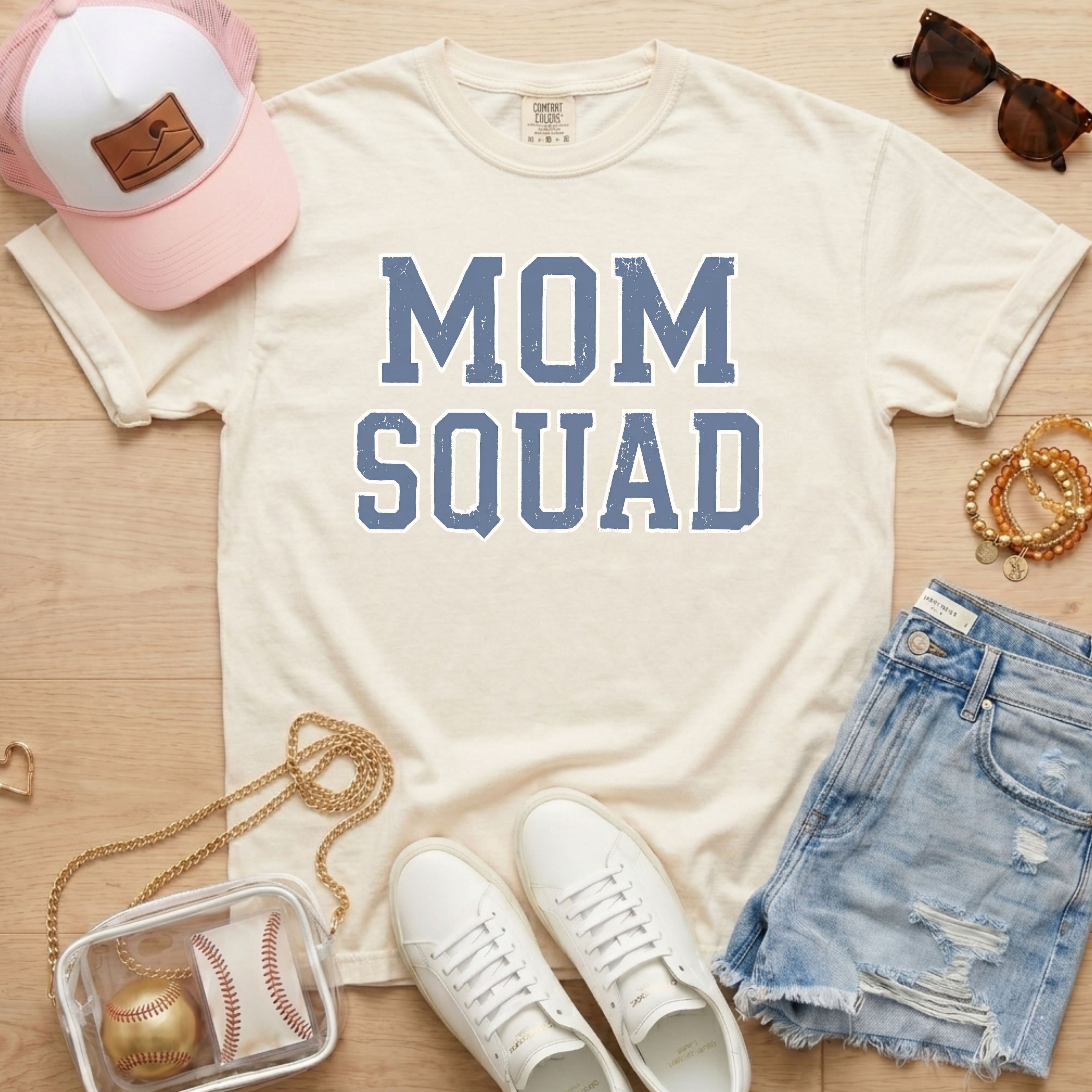 mom squad baseball mom shirt on ivory comfort colors tee styled with hat and denim shorts
