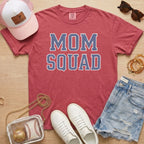 red mom squad baseball mom shirt styled with baseball glove and sporty accessories