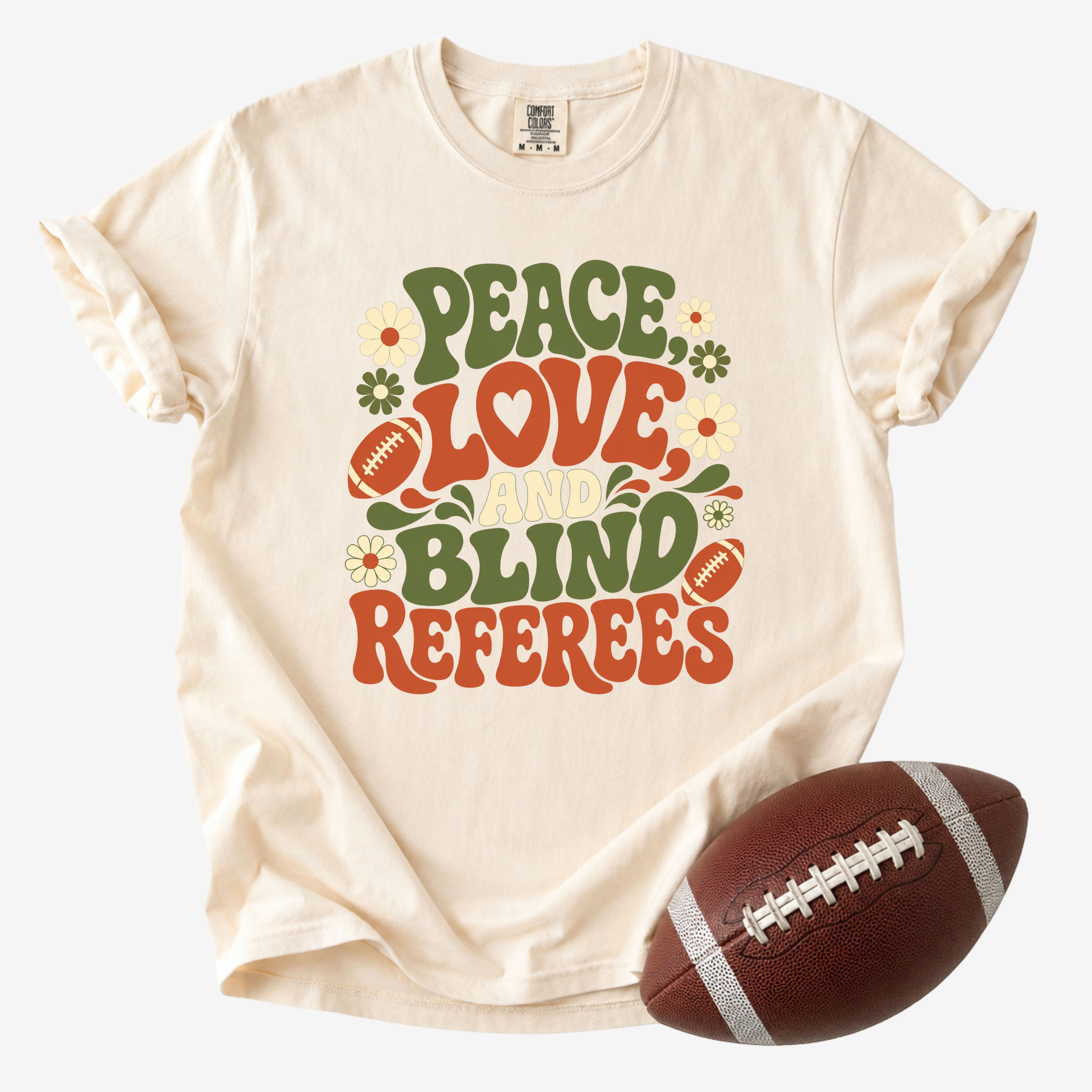 Peace Love and Blind Referees football mom Comfort Colors tee in ivory on white background with football.