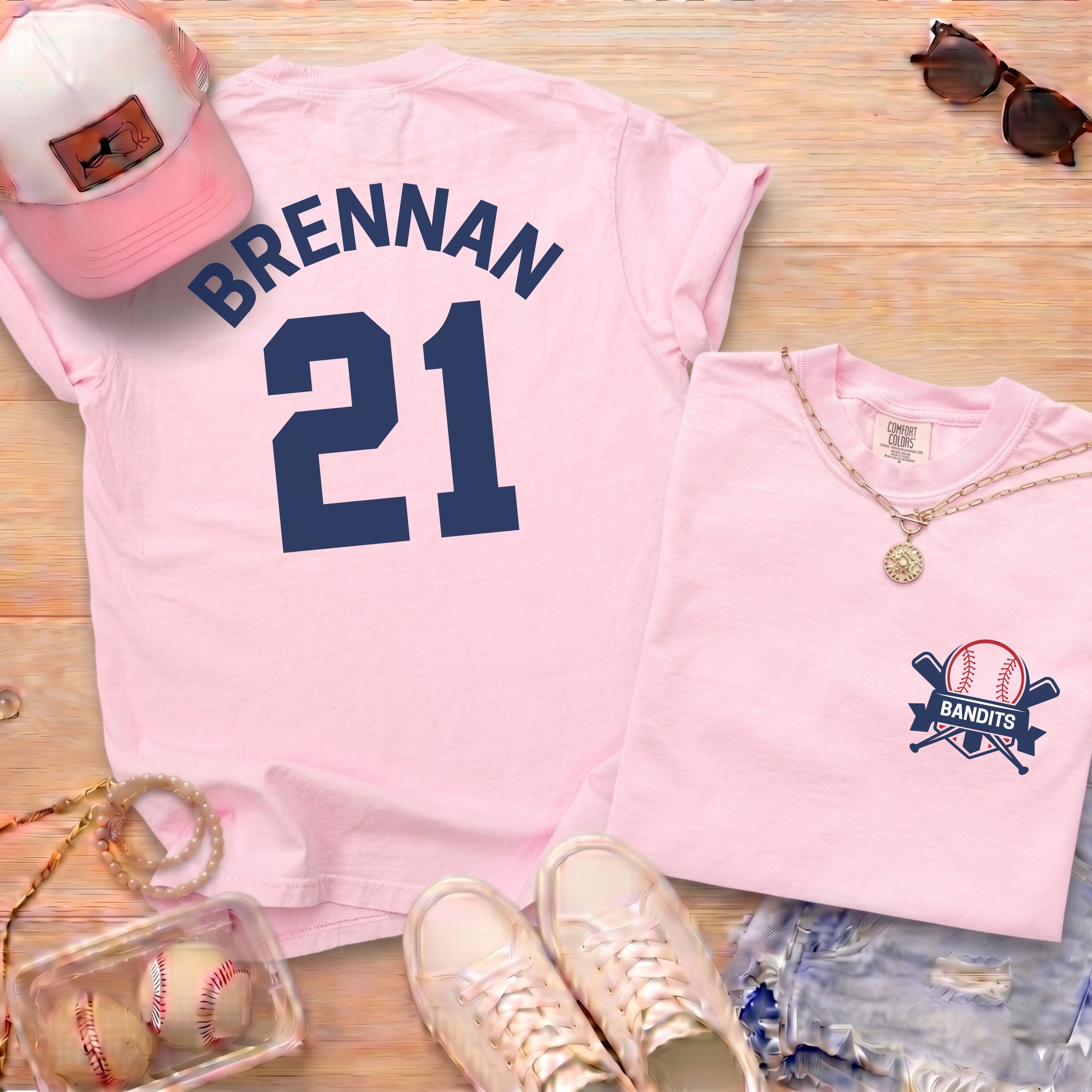 Pink Comfort Colors 1717 shirt featuring custom baseball player name Brennan 21 and Bandits logo on pocket area