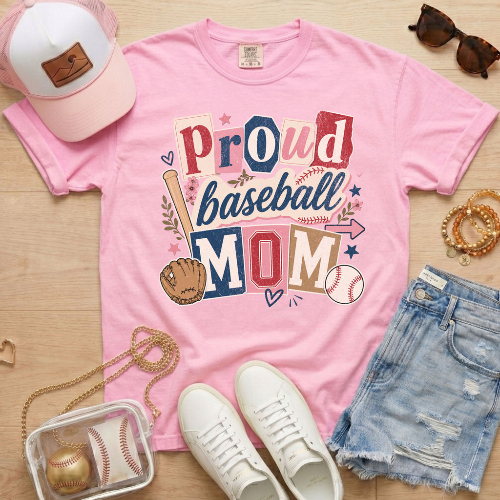 Proud baseball mom Comfort Colors blossom pink game day tee flat lay with hat sunglasses and accessories