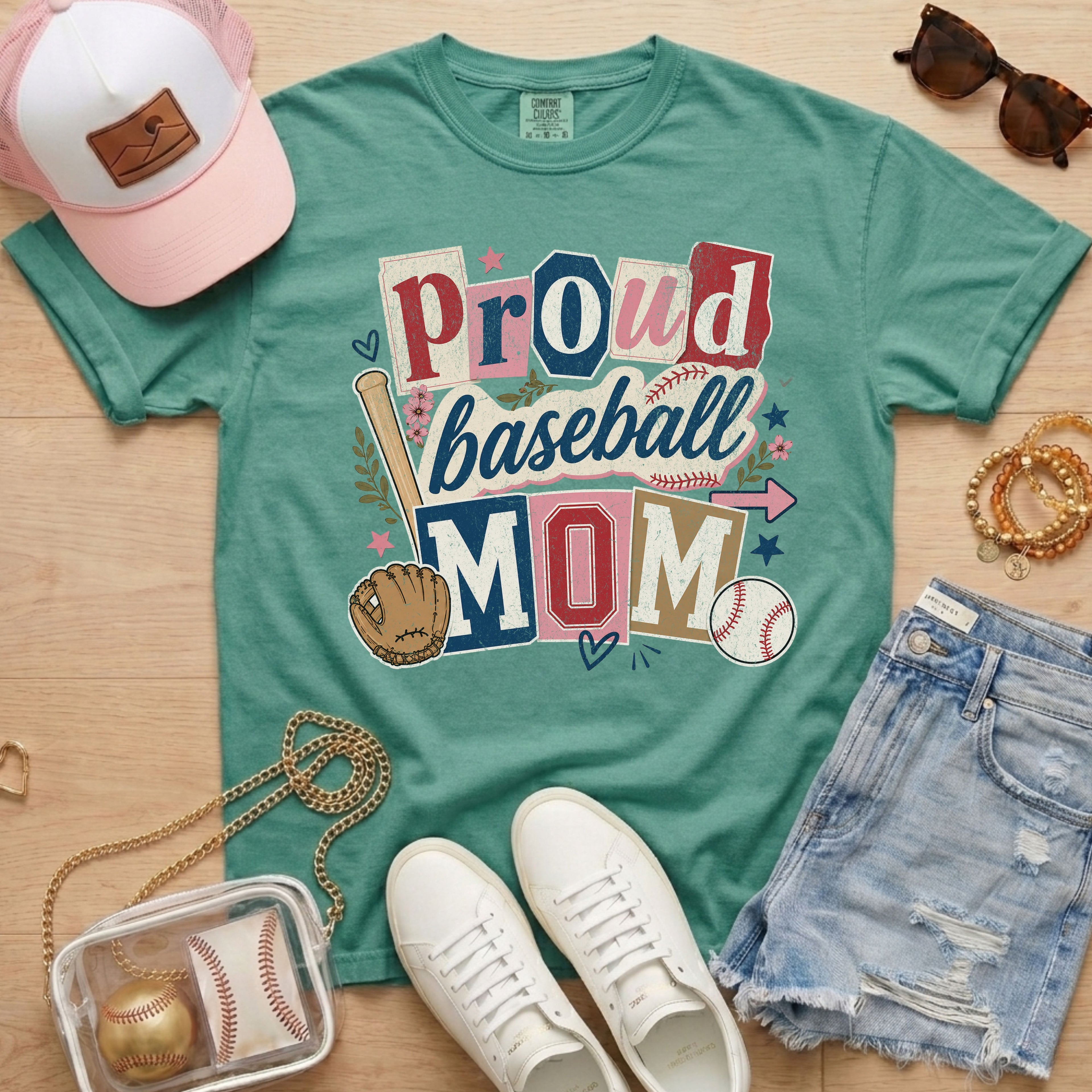 Proud baseball mom Comfort Colors light green game day tee lifestyle flat lay with accessories