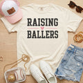 Ivory Raising Ballers T-Shirt styled for baseball mom game day outfits