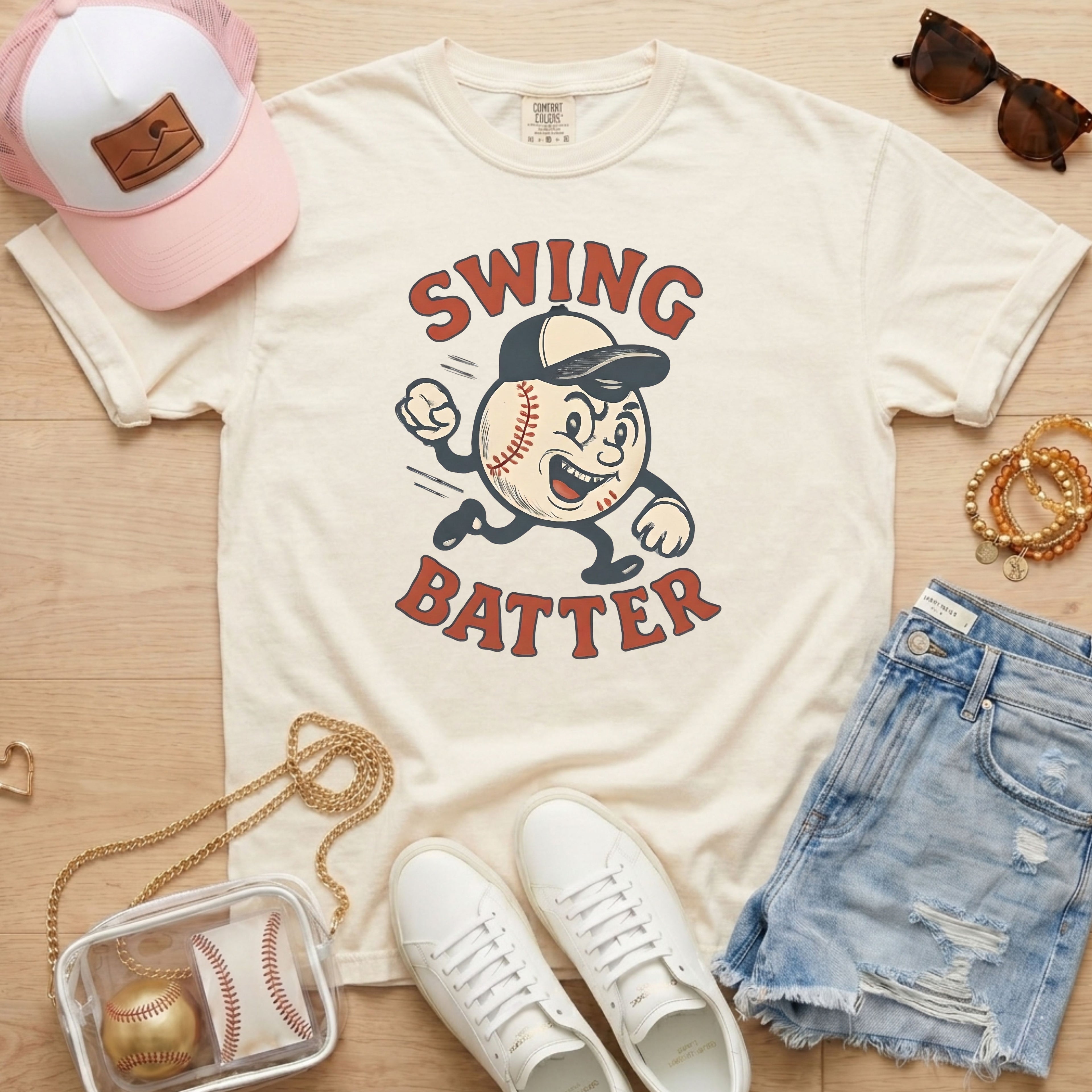 Vintage mascot baseball shirt in ivory styled with denim shorts and white sneakers for a gameday outfit