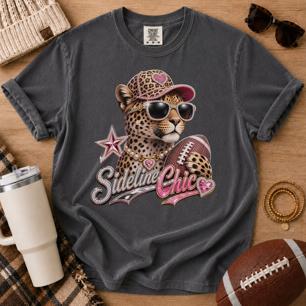 Charcoal gray football mom graphic tee, Comfort Colors Pepper, styled in a game day flat lay with a glamorous leopard, football and “Sideline Chic” design.