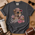 Charcoal gray football mom graphic tee, Comfort Colors Pepper, styled in a game day flat lay with a glamorous leopard, football and “Sideline Chic” design.