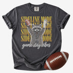 Football mom graphic T-shirt in charcoal gray, Comfort Colors Pepper, featuring a raccoon in heart sunglasses holding a football and tumbler with “Sideline Mode” and “Game Day Vibes” lettering.