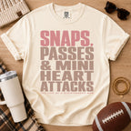 Cream quarterback mom shirt, Comfort Colors Ivory, styled in a game day flat lay with a football, tumbler and retro typography design.